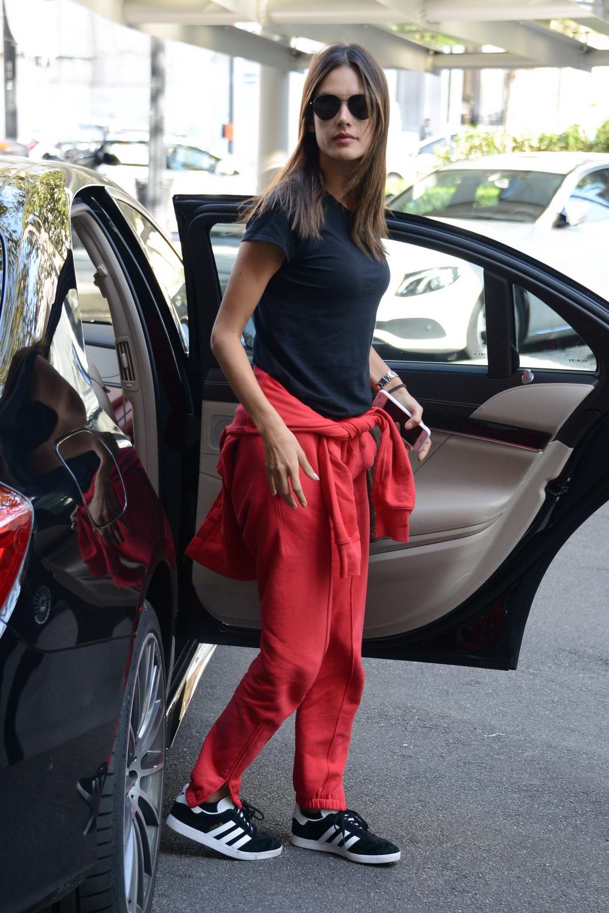 Alessandra Ambrosio In A Black Tee And Red Pants Arrives For Milan