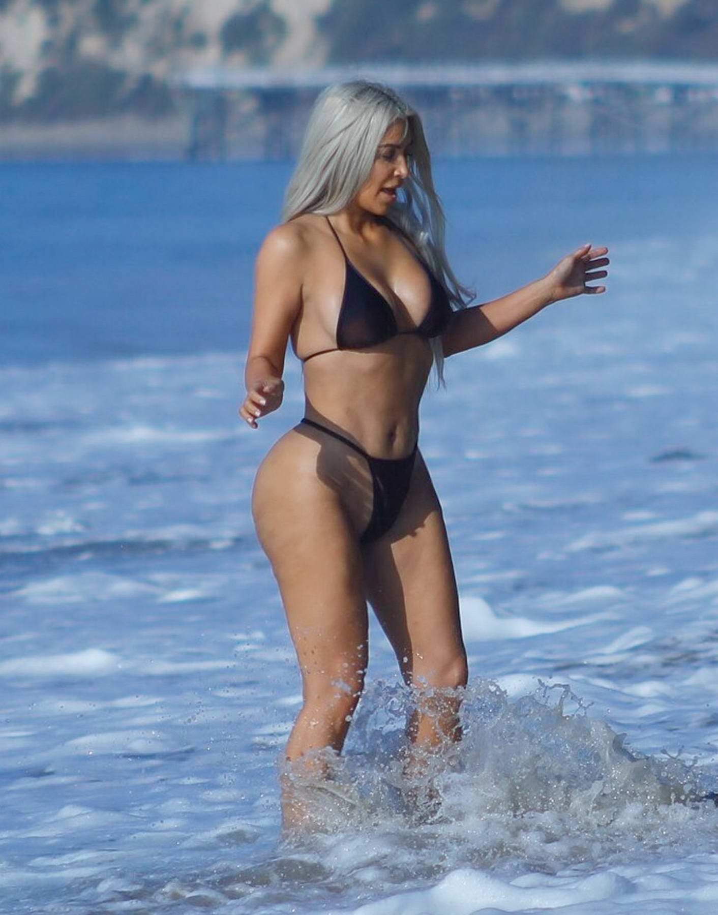 Kim Kardashian In A Black Bikini Enjoying Vacation With A Friend At The Beach