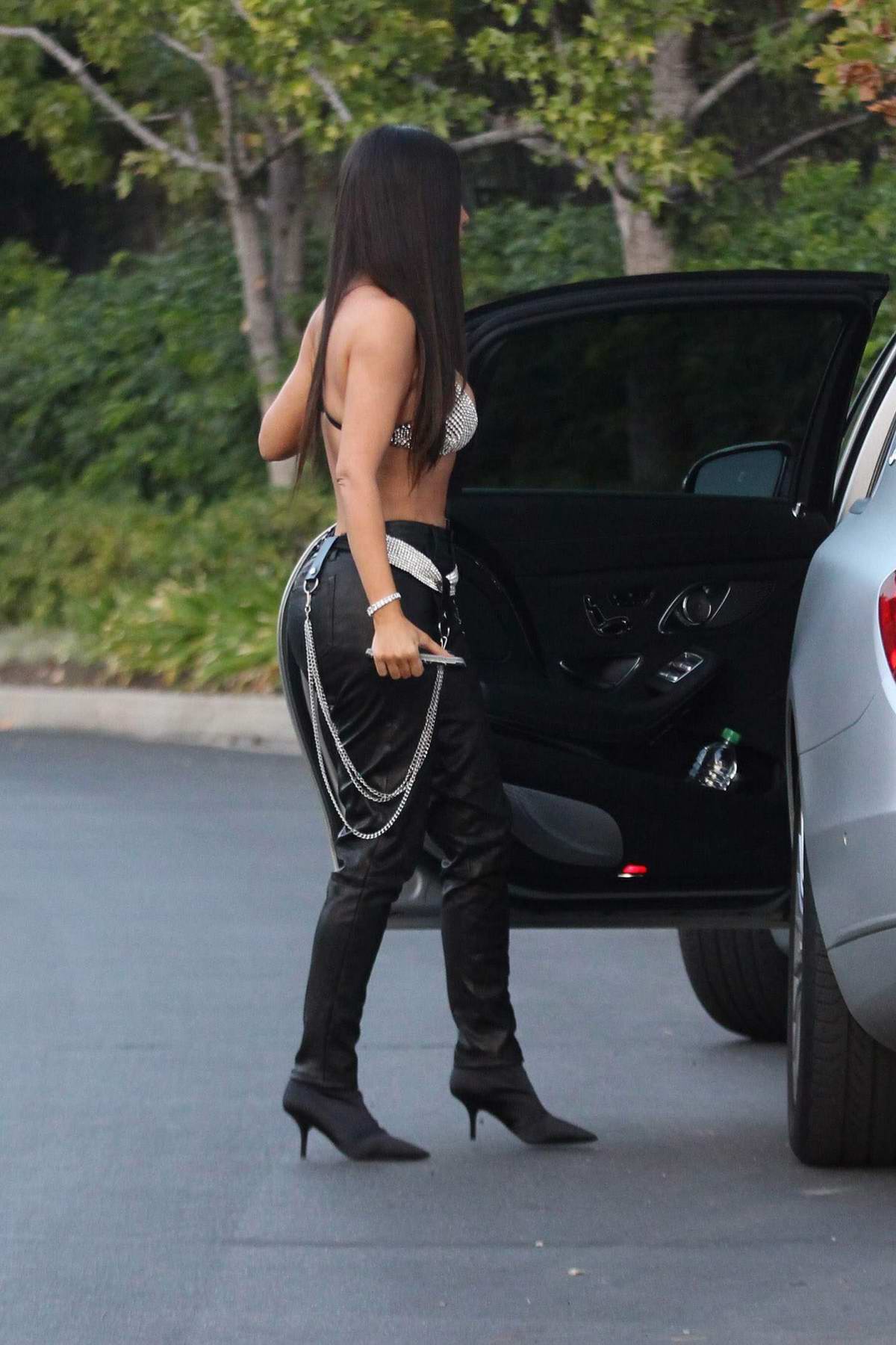 kim kardashian in bikini top and leather pants out in beverly hills