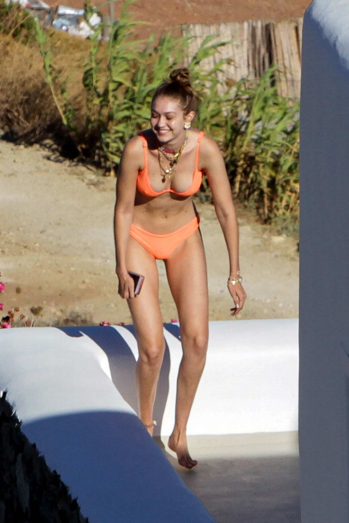 Gigi Hadid Wears An Orange Bikini While Enjoying The Sun With Mary Butler In Mykonos Greece