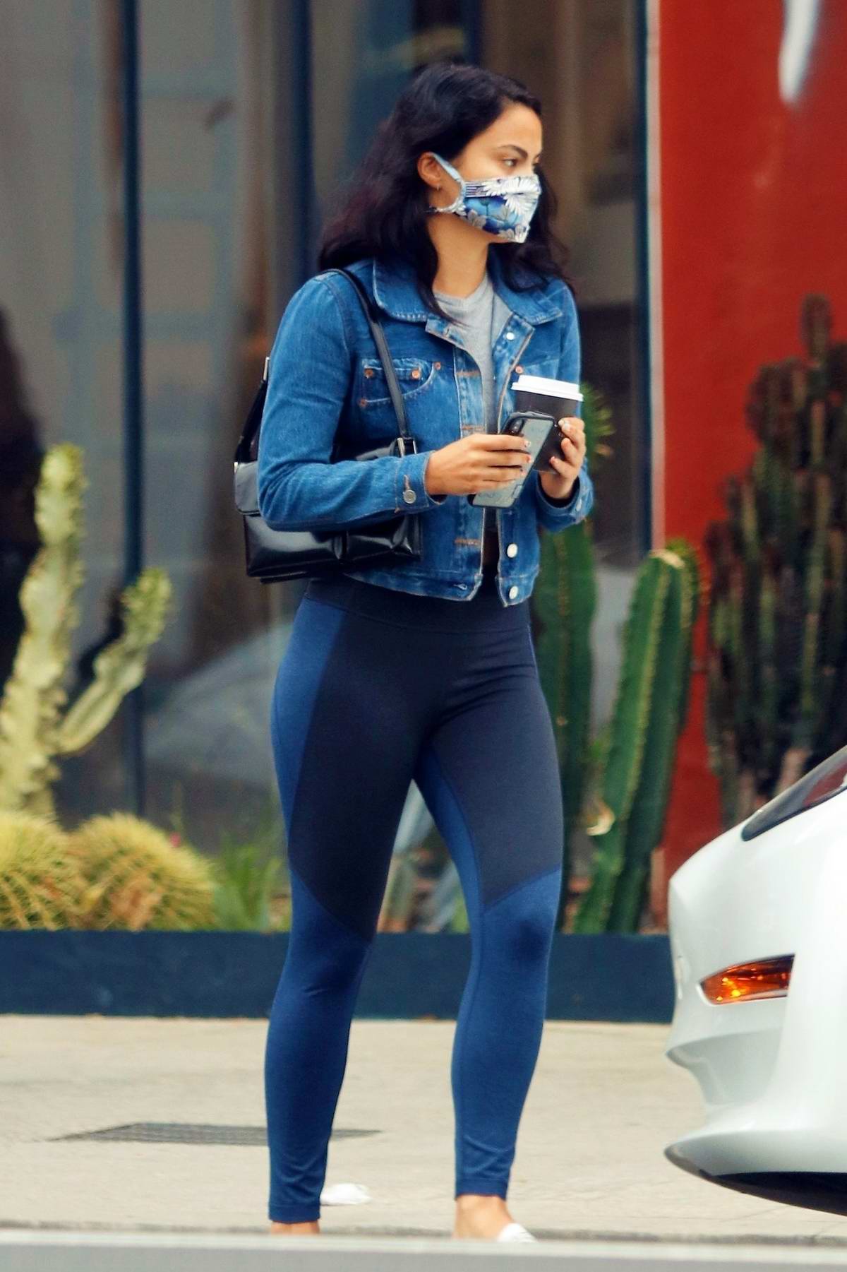 Camila Mendes Shows Off Her Toned Legs In Navy Leggings While Making A Coffee Run In Her Tesla