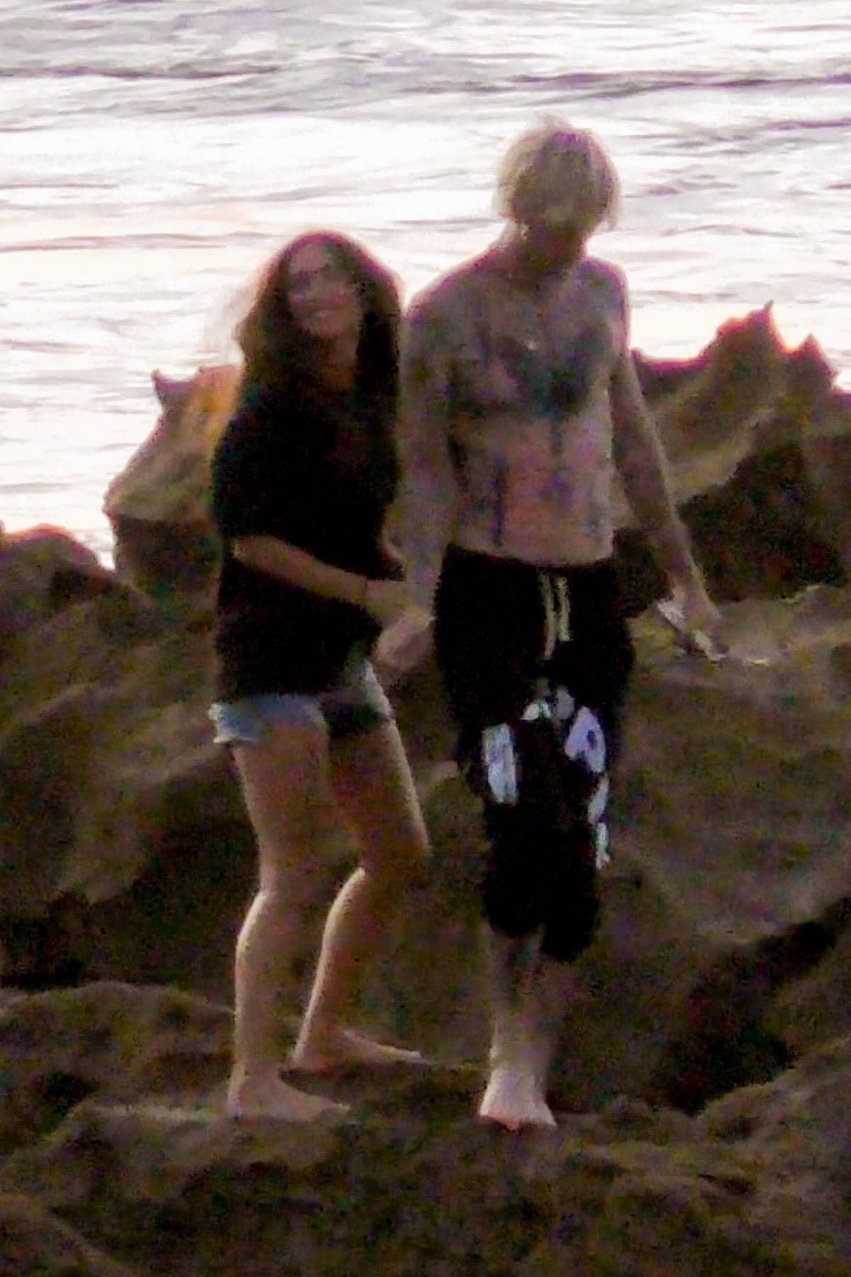 Megan Fox and Machine Gun Kelly go for a romantic stroll on the beach
