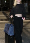 Elle Fanning in All Black arrives at LAX Airport in Los Angeles