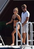 Kimberley Garner in a Black Bikini relaxing on a Yacht with Friends in Italy