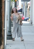 Minka Kelly carry her Dog while running errands in La Quinta, CA