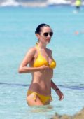 Jennifer Connolly, 52, looks decades younger in a tiny black bikini as she  takes a dip in the ocean on Spanish vacation