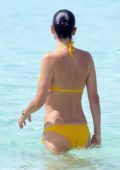 Jennifer Connolly, 52, looks decades younger in a tiny black bikini as she  takes a dip in the ocean on Spanish vacation