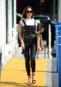 Olivia Culpo steps out wearing a pair of Leather Dungarees during a stop off to Bristol Farms in Beverly Hills