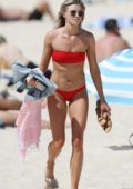 Amy Pejkovic in a red bikini on the beach in Sydney, Australia