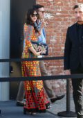 Dakota Johnson in a colorful dress arriving at the Gucci Show during Milan Fashion Week, Italy