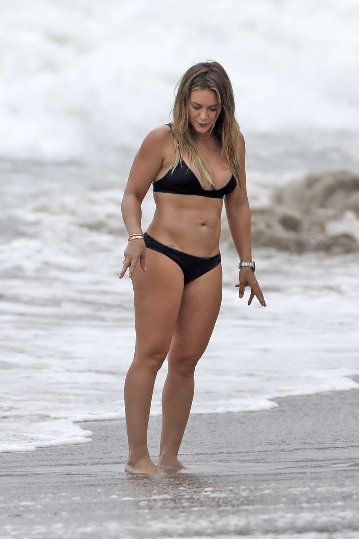 Hilary Duff flaunts her incredible figure in VERY tight swimsuit