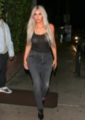 Kim Kardashian in a sheer tank top and jeans leaving Giorgio Baldi Restaurant after a dinner date with husband Kanye West in Santa Monica, California