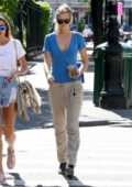 Toni Garrn wearing a blue t-shirt with matching blue leather bag while out in the West Village, New York City