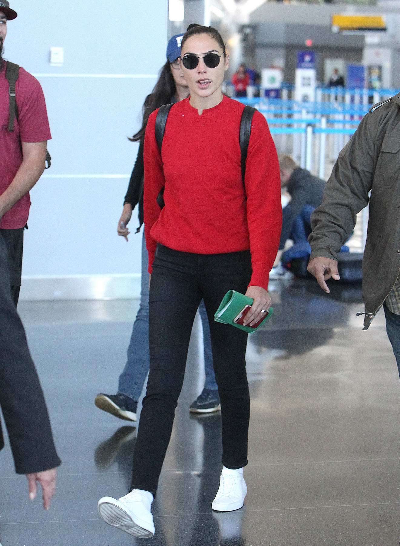 gal gadot in a red sweater arrives back at jfk airport in new york-011017_6