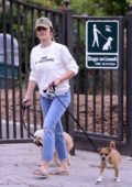 Minka Kelly sports a white sweater with jeans as she is seen enjoying time with her dogs at the park in Los Angeles