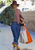 Ali Larter buys a large Christmas wreath from the farmers market in Los Angeles