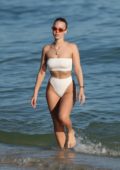 Bianca Elouise in a white bikini enjoying the beach with her boyfriend in Miami, Florida