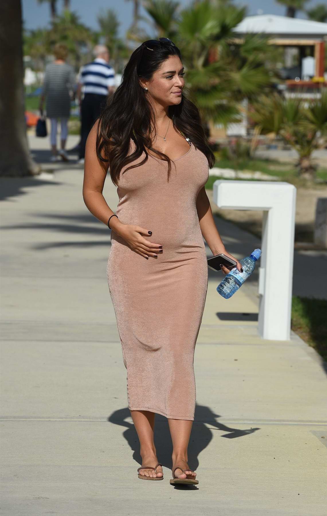 Casey Batchelor Shows Off Her Baby Bump While Taking A Stroll Along The