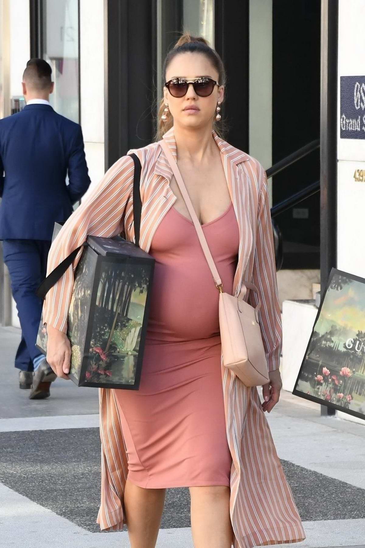 Jessica Alba in a peach dress grabs a few items at Gucci on Rodeo