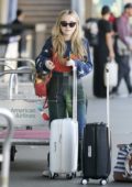 Sabrina Carpenter is seen carting her luggage at LAX Airport in Los Angeles