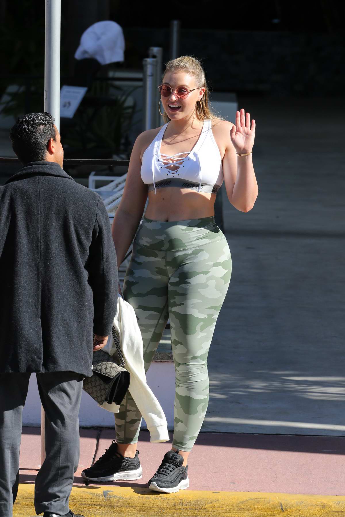 Iskra Lawrence wearing camo yoga pants and a sports bra as she