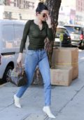 Kendall Jenner in a olive top and jeans exiting Rage Ground in Los Angeles