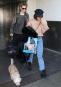 Vanessa Hudgens and boyfriend Austin Butler arrive at LAX with her dog