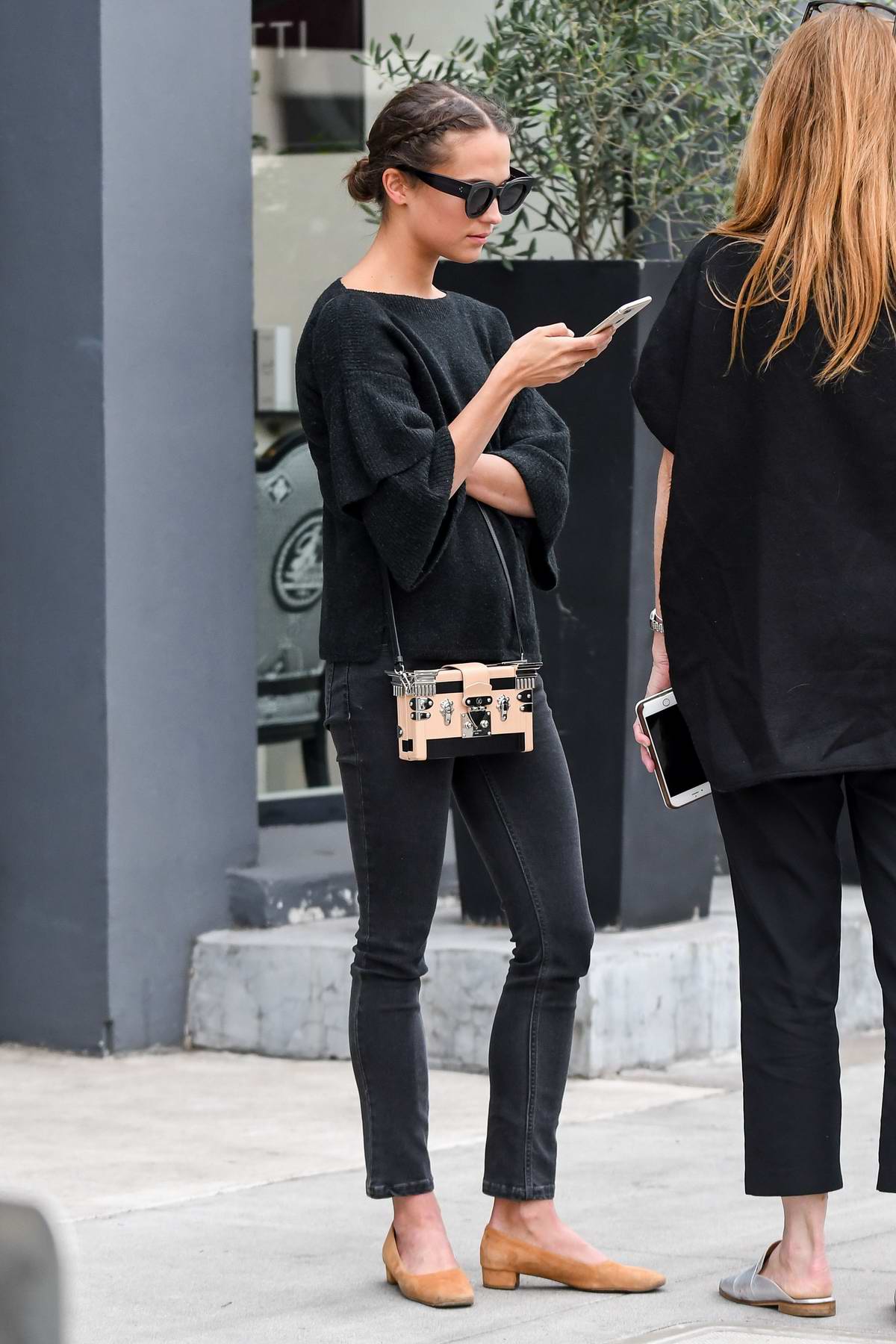 Alicia Vikander dressed in casual black, grabs lunch with a friend in  Beverly Hills, Los Angeles