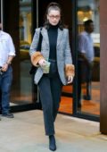 Bella Hadid grabs a coffee while out wearing a Fendi Houndstooth coat in New York City