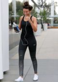 Michelle Keegan proves she can keep up with Hollywood stars as she carries  a £1,200 designer backpack to the gym in LA before heading to an ice hockey  game with Mark Wright