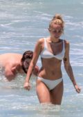 Miley Cyrus hits the ocean in a white bikini with Liam Hemsworth in Australia