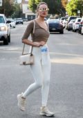 Olivia Culpo looks stunning in a brown top and white leggings while out in West Hollywood, Los Angeles