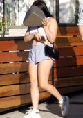 Ariel Winter tries to hide herself while out wearing a cropped tank top and short shorts in Studio City, Los Angeles