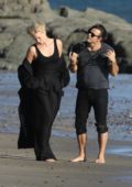 Charlize Theron spotted posing in a black outfit during a photoshoot in Malibu beach, California