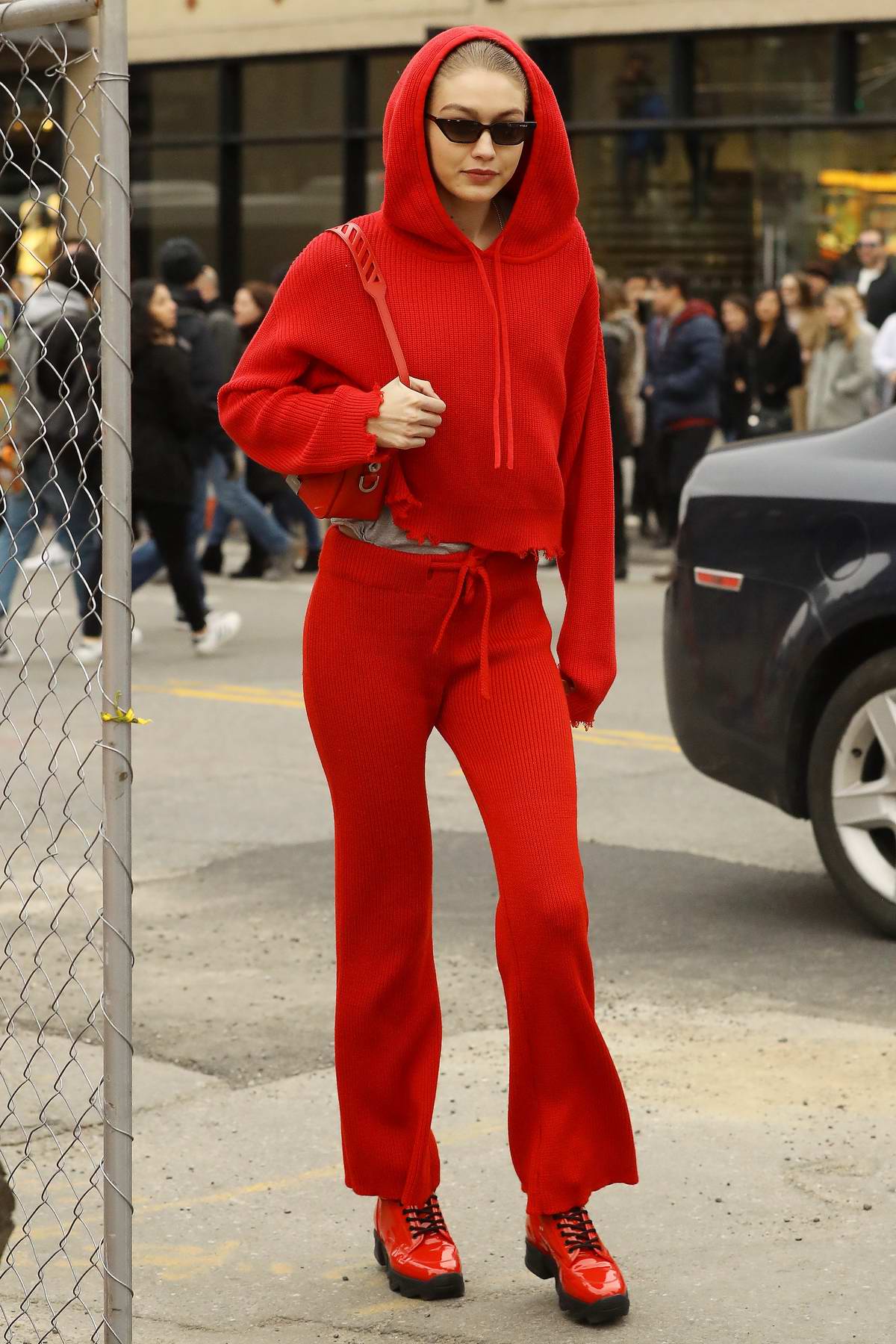 Gigi Hadid rocks an all red ensemble as she visits Louis Vuitton