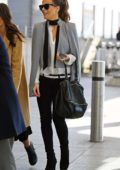 Kate Beckinsale looks stylish in grey cape as she lands at Heathrow airport in London