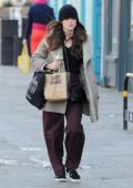 Keira Knightley wears a comfy jacket and a beanie while out for a walk after she grabbed lunch to go in North London