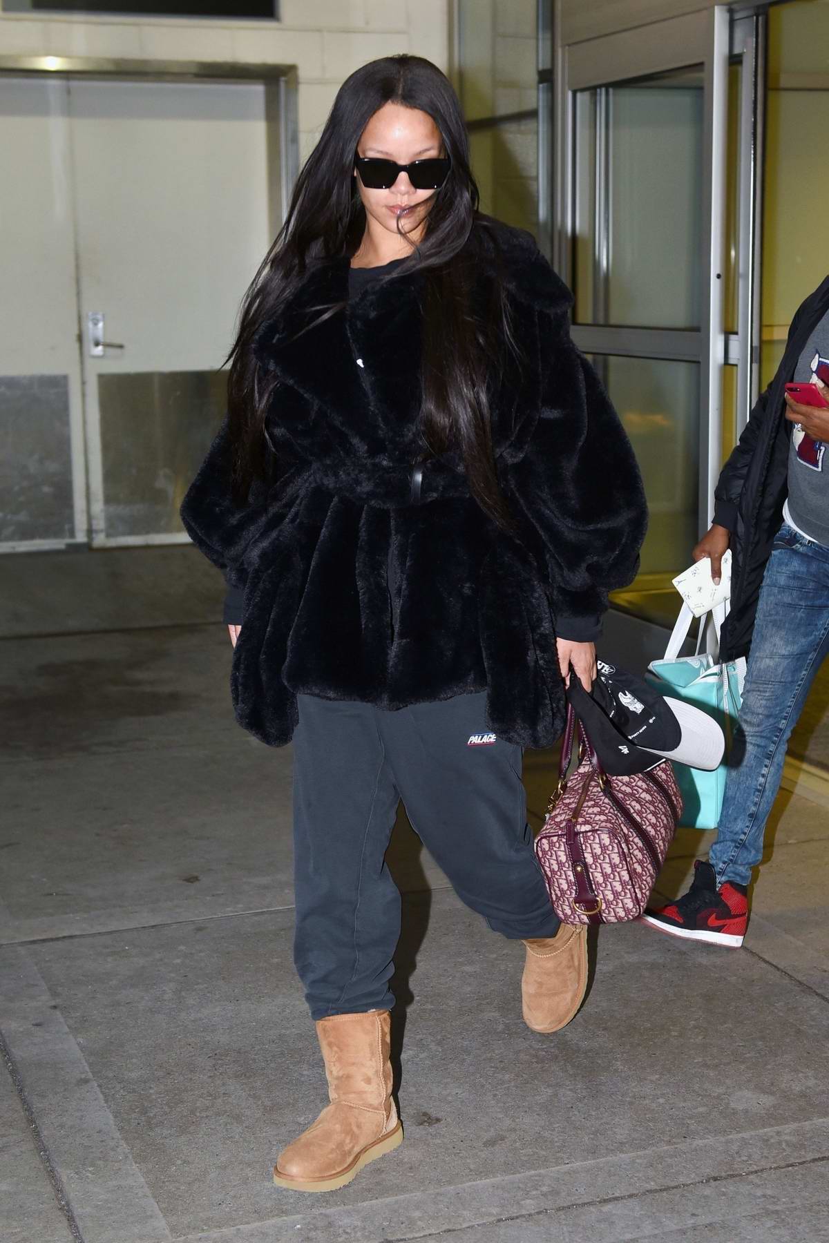 rihanna looks chic in her black fur coat and sweatpants with ugg boots ...
