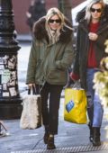 Sienna Miller wearing a fur lined parka with a Rag & Bone handbag while out with a friend in New York City