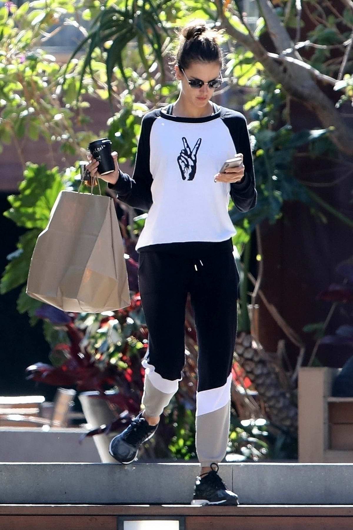 alessandra ambrosio wears a 'peace' top and track pants as she enjoys ...
