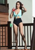 Chloe Goodman sips on a drink as she relax by the pool in a swimsuit while on holiday in Cyprus