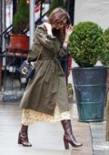 Emily Ratajkowski steps out in rain wearing a green trench coat in New York City