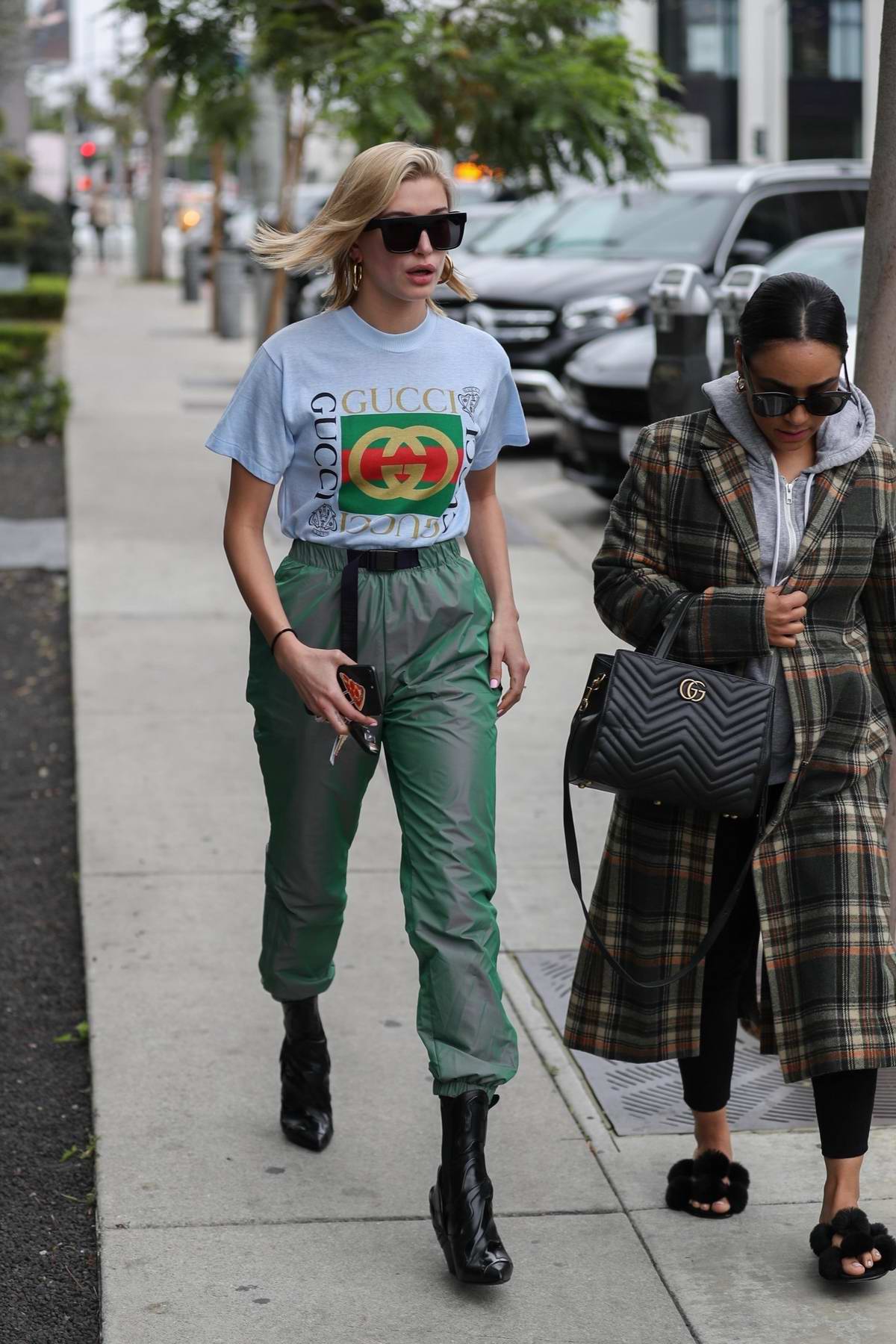 Hailey Baldwin wore a Gucci t-shirt tucked into green metallic