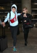 Nicola Peltz and Anwar Hadid touches down at LAX airport in Los Angeles