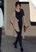 Karrueche Tran dons leather leggings and knee-high platform boots while out  in Studio City, California