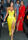 Kim Kardashian steps out for a family dinner wearing a bright yellow deep neck dress in Chinatown, New York City