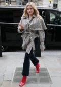 Chloe Grace Moretz steps out wearing a plaid coat and jeans with bright red boots in London, UK