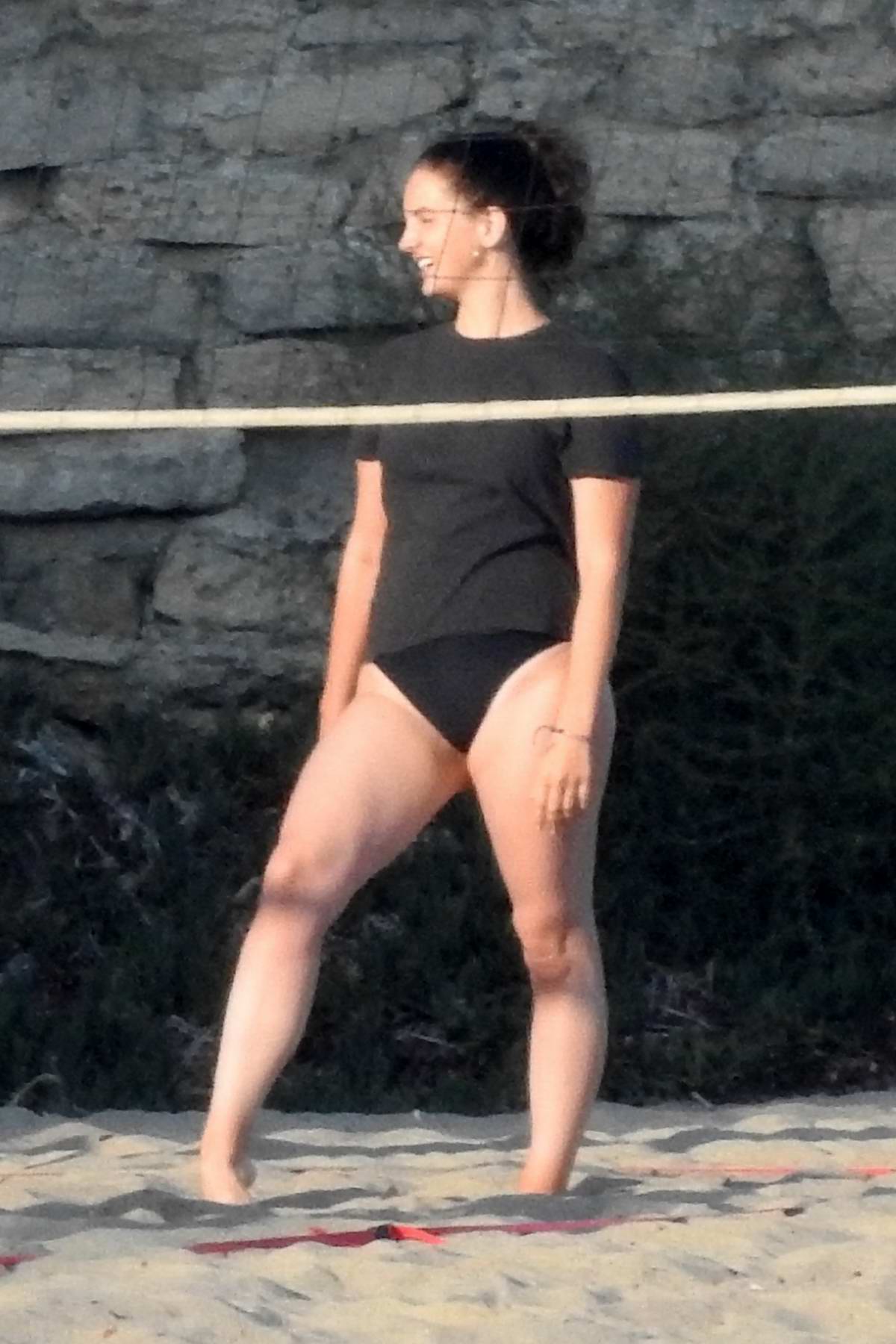 lana del rey wears a black swimsuit with a tee while playing volleyball on  the beach in malibu, california-260818_4