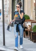 Alessandra Ambrosio wore a graphic tee and ripped jeans during a shopping trip to Mimi Luzon in Paris, France