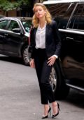 Amber Heard wearing classic black pantsuit as she arrives at 92Y in New York City